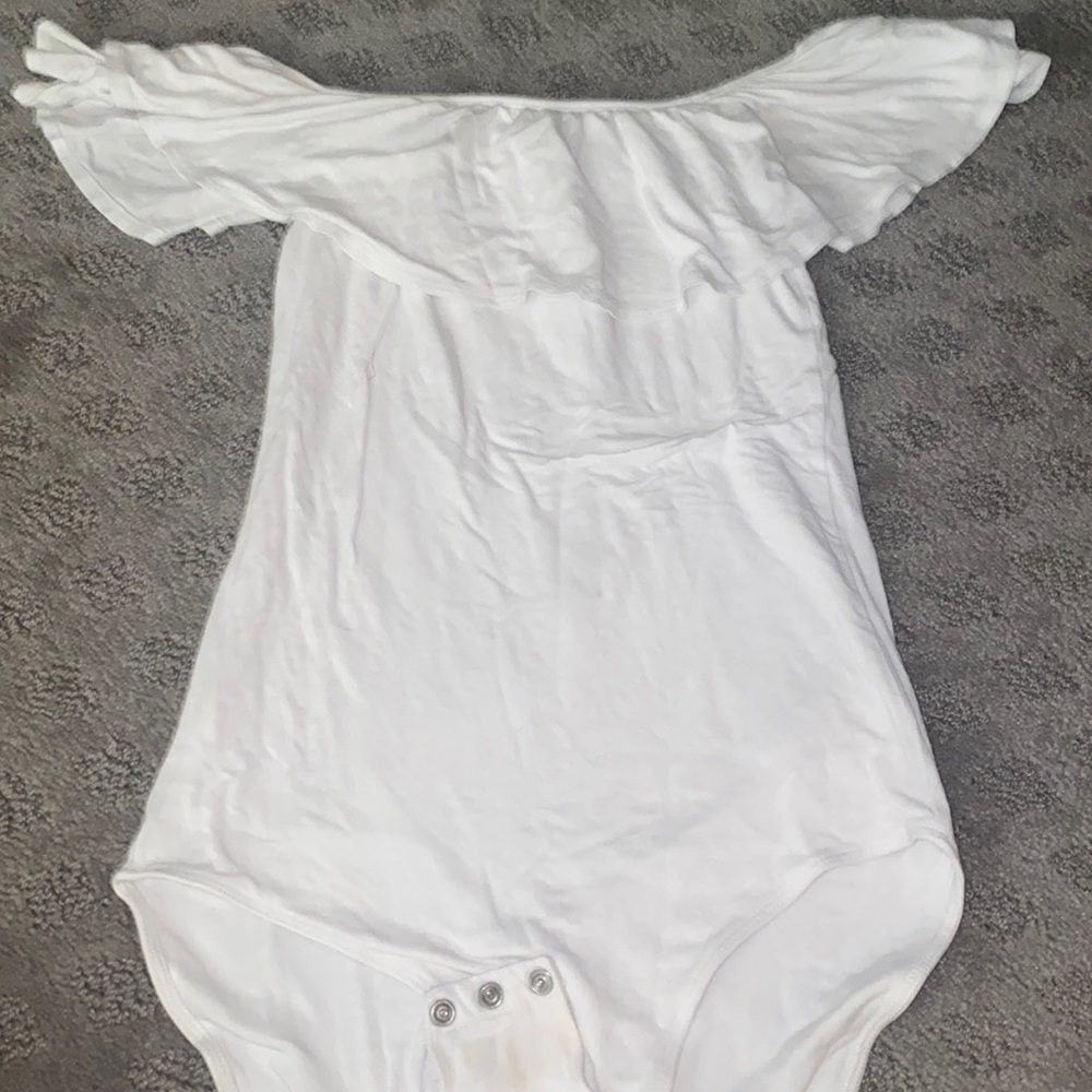 A white off the shoulder bodysuit